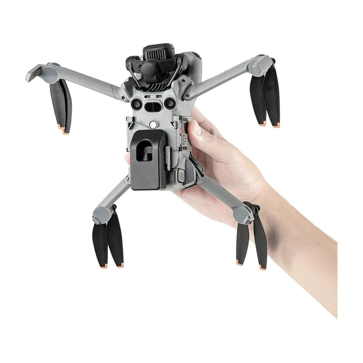 DJI Mini 5 Pro mit STARTRC Abwurfsystem von unten in der Hand